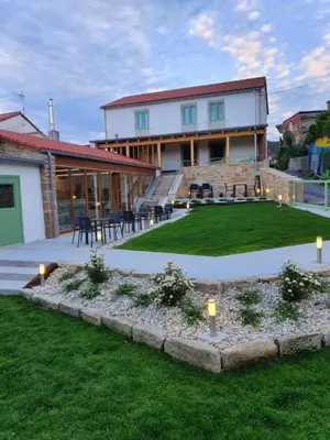 a house with a yard with lights in the grass at A Casa Do Boi in Amés