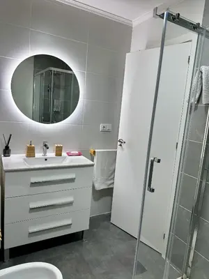 a bathroom with a white sink and a mirror at N&E - Home Celanova AVD San Rosendo in Celanova