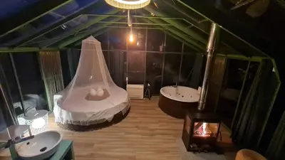 an attic bathroom with two sinks and a large mirror at REMANSO DE TRASFONTAO_Nido 360° in Silleda