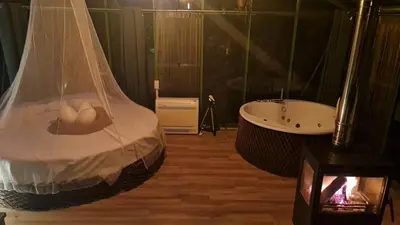a bedroom with a bed and a tub and a sink at REMANSO DE TRASFONTAO_Nido 360° in Silleda