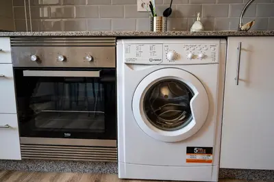 a white washer and dryer in a kitchen at Casa Bimba in Sober