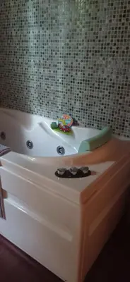 a bath tub with a toy sitting on top of it at Acogedora cabaña con piscina in Pontevedra