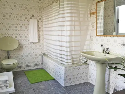 a bathroom with a sink and a toilet and a tub at Casa San Pablo in Melide