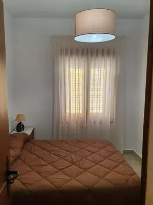 a bedroom with a bed and a large window at Casa Celedonio in Cerredo
