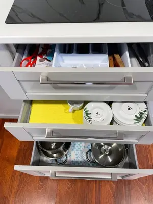 an open drawer of a refrigerator with dishes at Casa de Fernando in Tríacastela