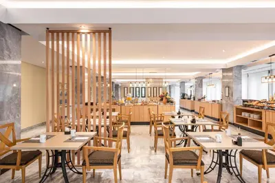 a restaurant with tables and chairs and a counter at Exe Auriense in Ourense