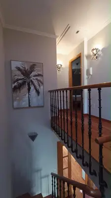 a living room with a couch and a rug at Duplex acogedor CAMINO INGLÉS a 10 min de Santiago in Sigüeiro