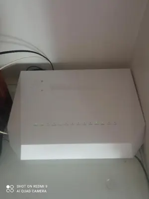 a white microwave oven sitting on top of a counter at Precioso loft a 600m de la catedral in Santiago de Compostela