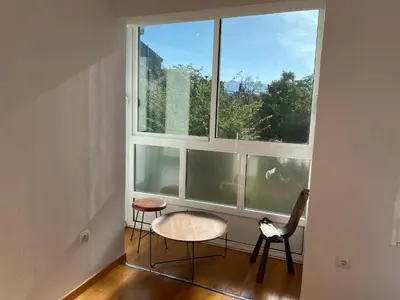 a room with two chairs and a large window at Casa de la abuela Elisa - Ribeira Sacra - Cañones del Sil - Caurel in Quiroga