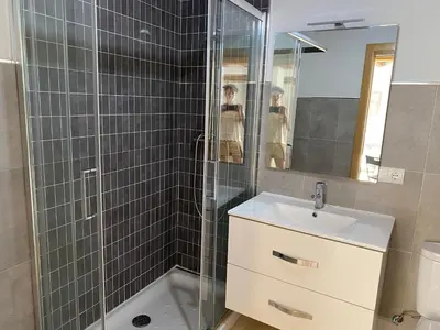 a bathroom with a shower and a sink and a mirror at Casa de la abuela Elisa - Ribeira Sacra - Cañones del Sil - Caurel in Quiroga