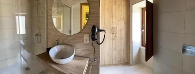 a bathroom with a phone next to a mirror at Casa da Cota in Monterroso