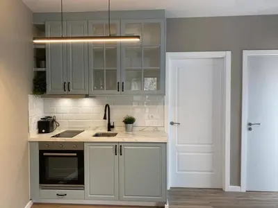 a kitchen with white cabinets and a sink at A PONTEVELLA Alojamiento Boutique, Sobradelo in Sobradelo
