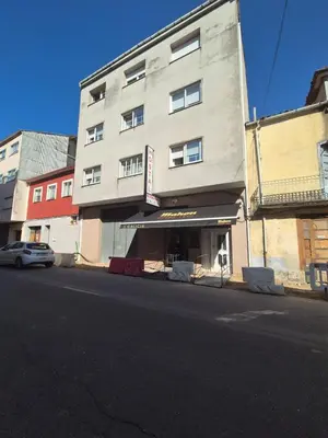 a building on the side of a street at Hostal Galicia in Monforte de Lemos