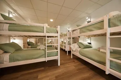 a group of bunk beds in a room at ALBERGUE SEGUE O CAMIÑO in Sigüeiro