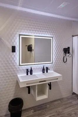 a bathroom with a white sink and a mirror at ALBERGUE SEGUE O CAMIÑO in Sigüeiro
