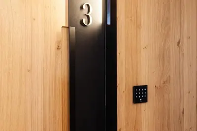 a close up of a door with the number three at Hotel Plaza Obradoiro by Bossh! Hotels in Santiago de Compostela