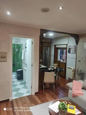 a living room with a couch and a table at Apartamento Cervantes in Ourense