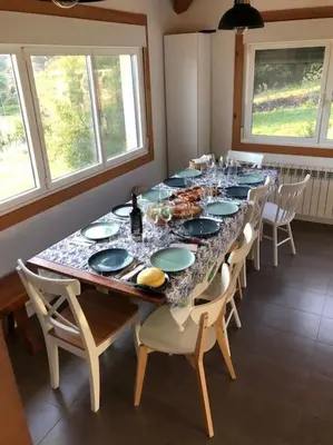 a long table with blue and white dishes on it at A Casa do Portal, tu casa rural en Campo Lameiro, cerca de Pontevedra in Campo Lameiro