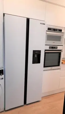 a kitchen with two refrigerators and a microwave at Apartamento con encanto en centro histórico Lugo -TineriaLucusHome in Lugo