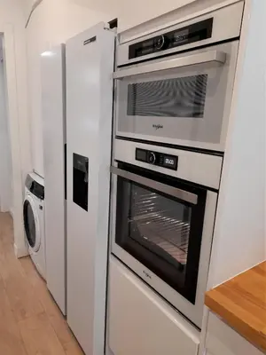 a kitchen with an oven and a refrigerator at Apartamento con encanto en centro histórico Lugo -TineriaLucusHome in Lugo