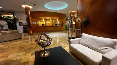 a living room with a couch and a table at Hotel Alfonso IX in Sarria