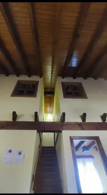 a stairway in a building with a wooden ceiling at Villa Quijada in Trefacio