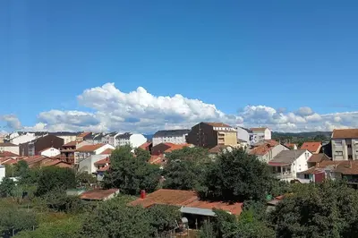 a view of a city with buildings and trees at Corazón de Lemos in Monforte de Lemos