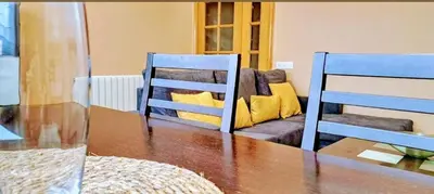a living room with a table and a couch at Corazón de Lemos in Monforte de Lemos