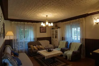 a living room with couches and a table at Casa Gayol in El Franco