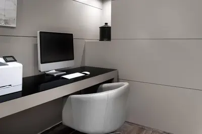 a room with a desk with a computer and a chair at AC Hotel Ponferrada by Marriott in Ponferrada