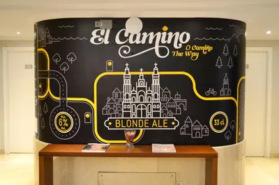 a black wall with a disney sign on it at Hotel Alda San Carlos in Santiago de Compostela