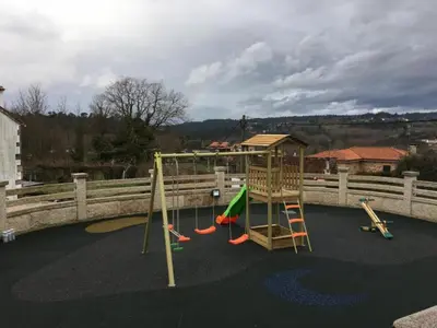 a playground with a slide and a swing set at House - 4 Bedrooms with Pool - 4093 in A Estrada