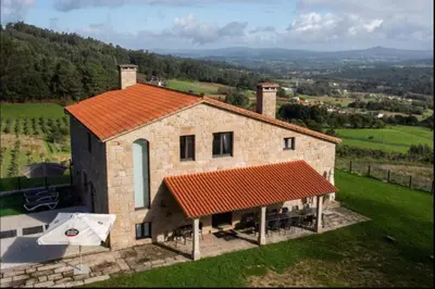 an aerial view of a stone house with an orange roof at Villa - 5 Bedrooms with WiFi - 7841 in A Estrada