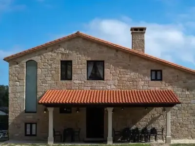 a large stone building with a red roof at Villa - 5 Bedrooms with WiFi - 7841 in A Estrada