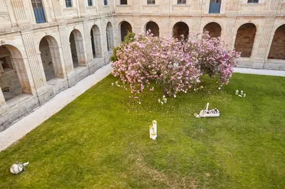 an overhead view of a garden with pink flowers at Eurostars Monumento Monasterio de San Clodio Hotel in Leiro