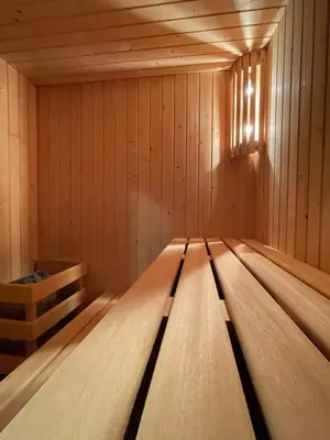 a wooden floor in a sauna at Guiana Rooms & Suites in Ponferrada