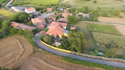 an aerial view of a house with a road at Casas de Maragouzos in Silleda