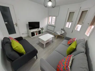 a living room with two couches and a tv at Acea Nova 3 in Monforte de Lemos