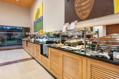 a restaurant with a buffet line with food at Eurostars San Lazaro in Santiago de Compostela