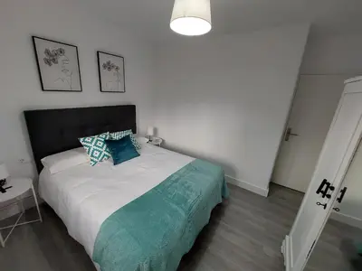 a bedroom with a large bed with a pillow on it at Acea Nova 2 in Monforte de Lemos