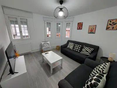 a living room with a couch and a table at Acea Nova 2 in Monforte de Lemos