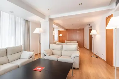 a hotel room with a bed and a desk at Dorma Puerta de San Pedro in Lugo