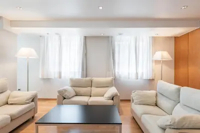 a lobby with a bar with wood paneling at Dorma Puerta de San Pedro in Lugo