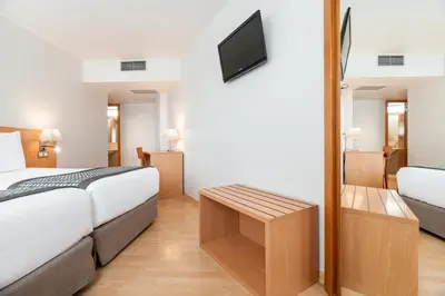 a living room with two couches and a coffee table at Dorma Puerta de San Pedro in Lugo
