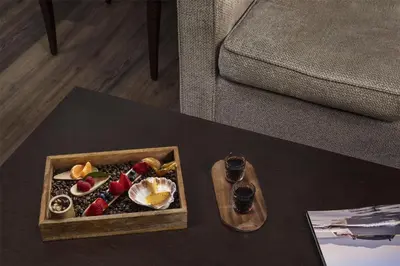 a table with a tray of food on top of a table at NH Collection Santiago de Compostela in Santiago de Compostela