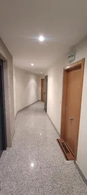 an empty room with a hallway with a door at Piso Estación Termal II in Ourense