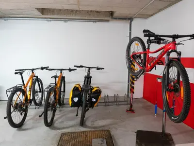 a group of bikes parked in a garage at LUMEN ALBERGUE in Mondoñedo