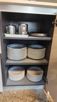 a cabinet filled with plates and pans and dishes at Casa Vilar de Flores in Ourense