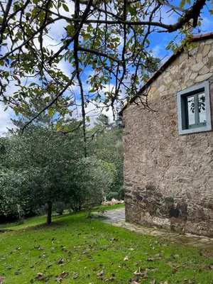 a stone building with a window on the side of it at Rural Lambre by Miramar Stays in A Coruña