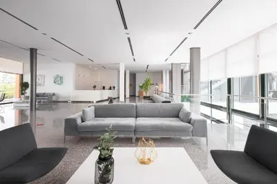 a living room with a couch and a table at Exe Vía Argentum in Silleda
